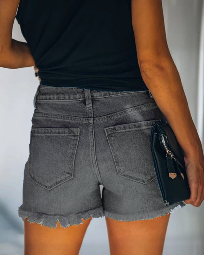 Mid-rise gescheurde denim shorts